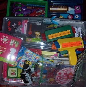 Scrapbooking papers, scissors, glitter, stickers, crimpers and lots of other cool junk.