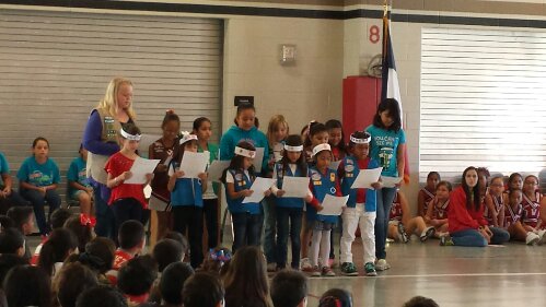 Alaethia and her troop reciting a poem during the Veteran's Day assembly