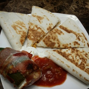 Bacon wrapped jalapenos and quesadillas