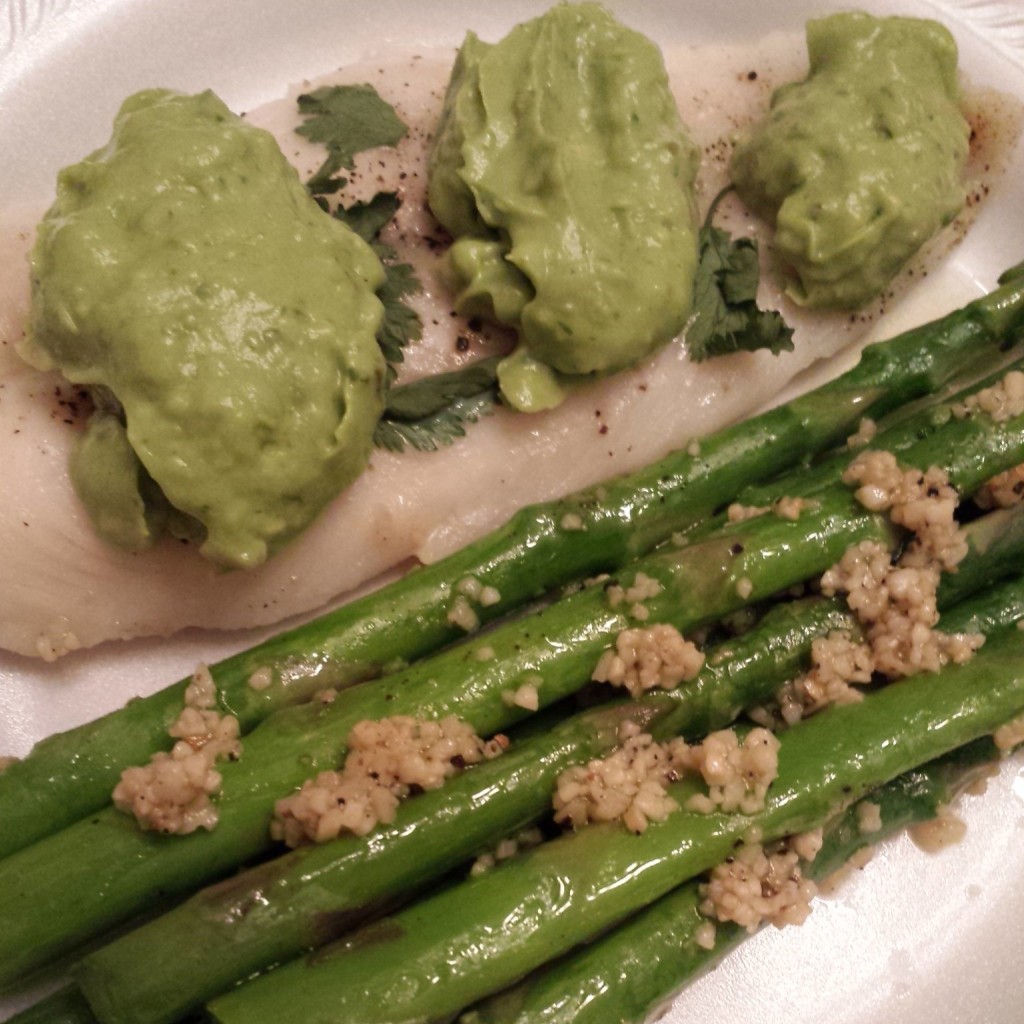 Whiting with avocado sauce and garlic asparagus